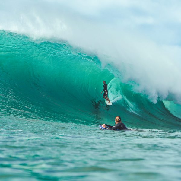 Surf Photographer capturing an epic shot of pro surfer Cody Young getting barreled at pumping Honolua Bay