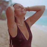 Lifestyle Photography of girl in the rain on a beach in Hawaii