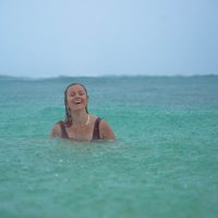 Lifestyle Photography of girl in the rain on a beach in Hawaii