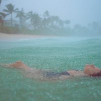 Lifestyle Photography of girl in the rain on a beach in Hawaii