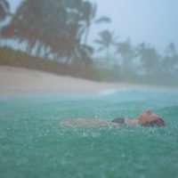 Lifestyle Photography of girl in the rain on a beach in Hawaii