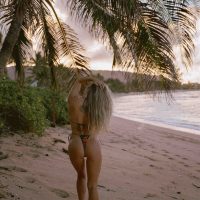 Lifestyle photography picturing a girl in a bikini on a beach on Oahu's North Shore