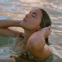 Lifestyle photography picturing a girl in a bikini on a beach on Oahu's North Shore