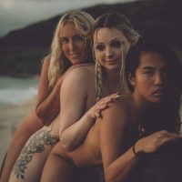 Photograph from lifestyle photography session picturing 3 girls on a horse on a beach in Hawaii.