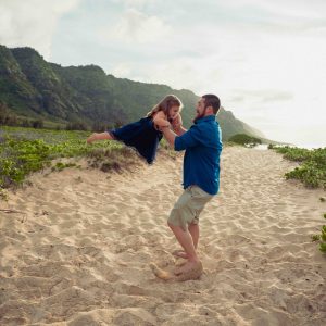 Photograph of dad playing with his daughter during a family portrait session