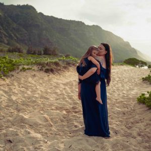 Photograph of mother holding her daughter during a family portrait session