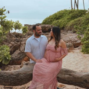 Couple posing for their maternity photos