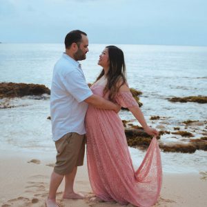 Couple posing for their maternity photos