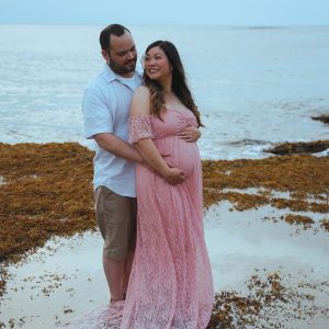 Couple posing for their maternity photos