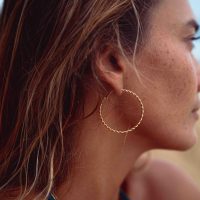 Product Photography. Lifestyle Photography of a woman in her bikini on the beach in Hawaii