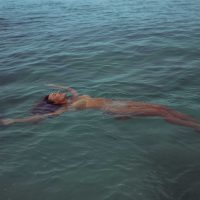 Lifestyle Photography of a woman in her bikini on the beach in Hawaii