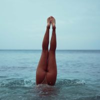 Lifestyle Photography of a woman in her bikini on the beach in Hawaii