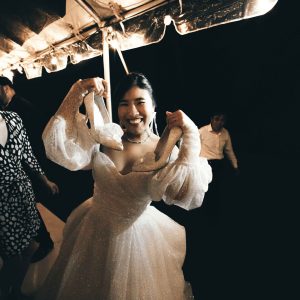 Photograph of bride dancing at wedding reception