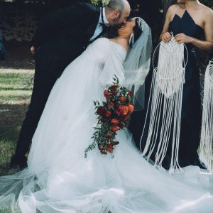 Bride and groom kissing after wedding ceremony