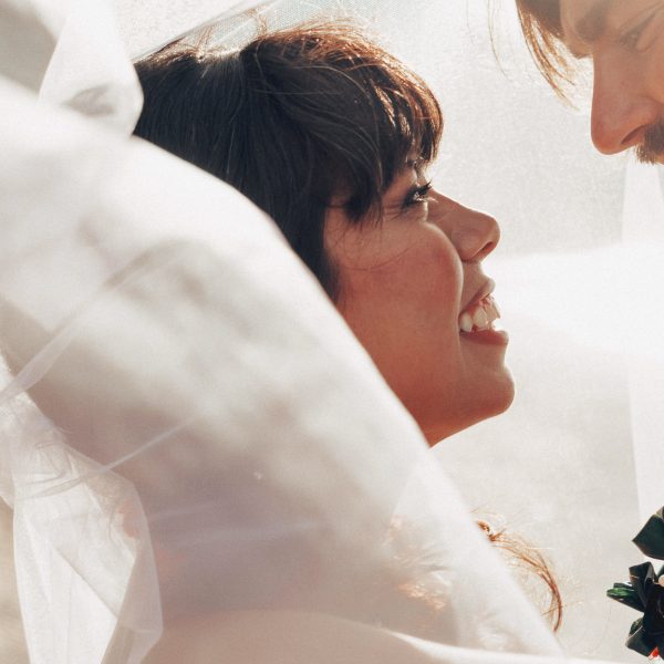 Hawaii Wedding Photographer capturing First kiss between newly weds during Kuaui Wedding